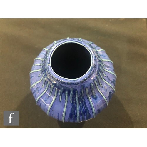 40 - Doulton Lambeth - An early 20th Century vase of gourd form, the whole decorated in a streaked blue g... 