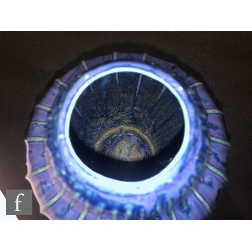 40 - Doulton Lambeth - An early 20th Century vase of gourd form, the whole decorated in a streaked blue g... 