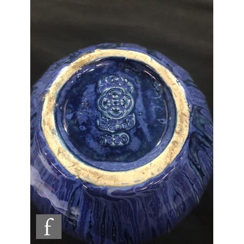 40 - Doulton Lambeth - An early 20th Century vase of gourd form, the whole decorated in a streaked blue g... 