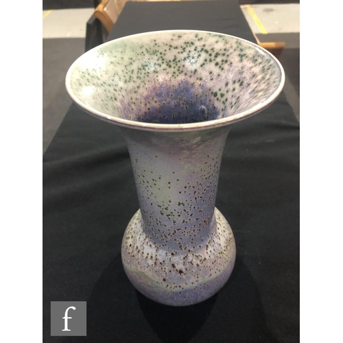 46 - Ruskin Pottery - A high fired vase of globe and flared shaft form decorated in a tonal lavender and ... 