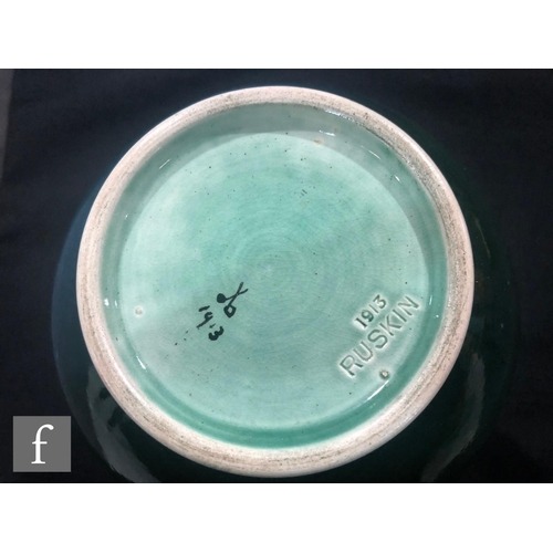 48 - Ruskin Pottery - A souffle glazed vase of angular form with a cylinder neck decorated in a mottled g... 