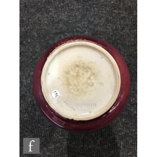 50 - Ruskin Pottery - A high fired vase of tapering form decorated in a Sang de Beouf with light fissurin... 