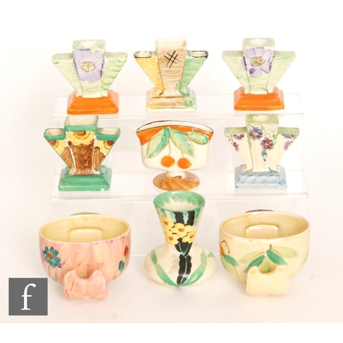 133 - A collection of assorted 1930s Art Deco Myott to include stepped candlesticks, posy vases and handle... 