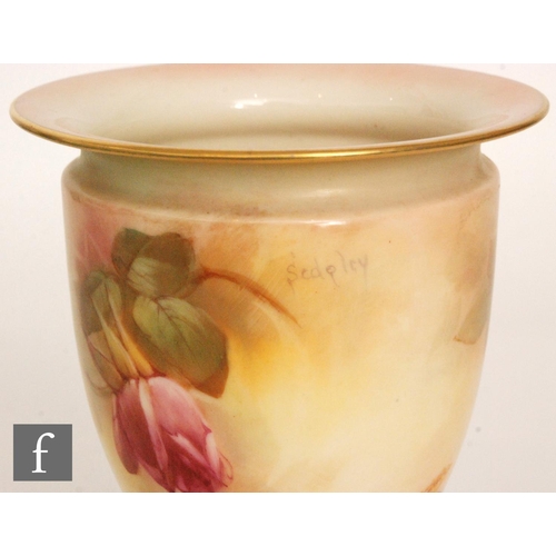 38 - A Royal Worcester pedestal vase, shape 2638 panel decorated by Sedgley with hand painted roses, sign... 