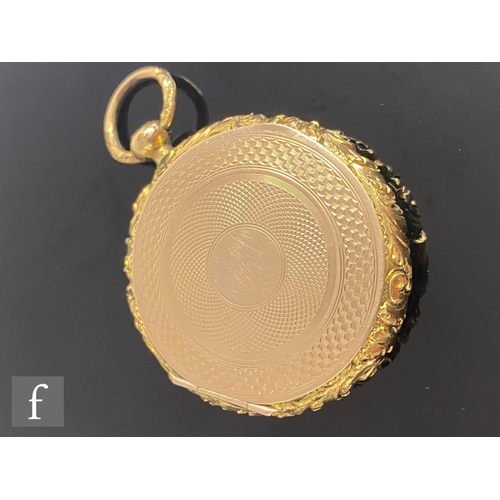 526 - A 19th Century 9ct double sided circular locket with a portrait daguerreotype of a man to one side a... 