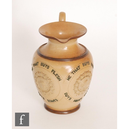 82 - An early 20th Century Doulton Lambeth stoneware motto jug decorated to the body with the motto 'He t... 