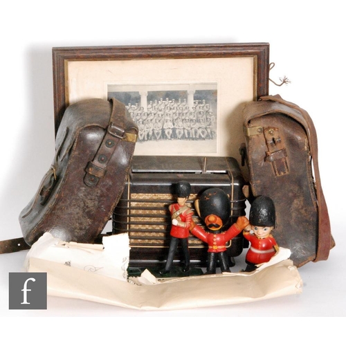 763 - A Phillips 209U brown Bakelite radio in original box, two First World War leather panniers with stra... 