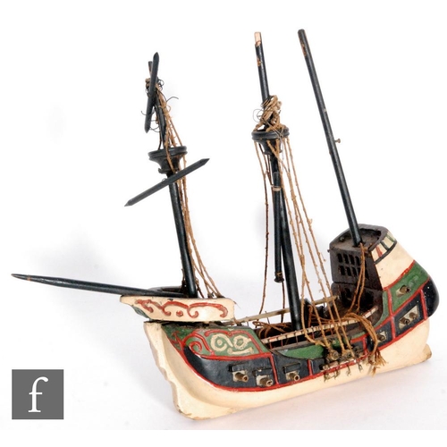 734 - A 1930s or later painted wooden model of a fourteen gun swivel galleon, length 33cm, A/F.