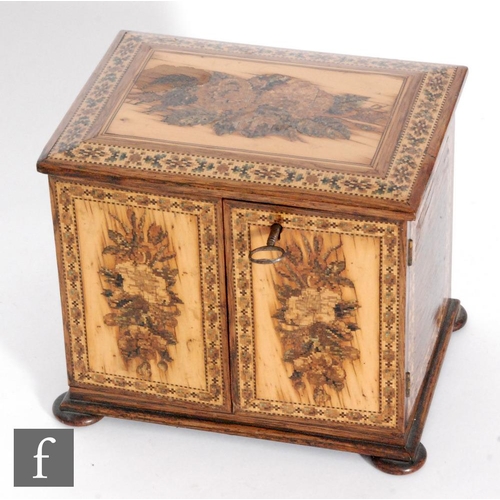 764 - A 19th Century Tunbridgeware mosaic inlaid table cabinet fitted with three drawers enclosed by a pai... 