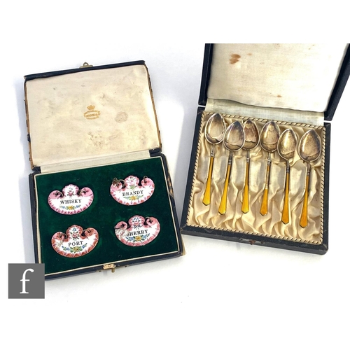 488 - A set of late 19th Century enamelled decanter labels for Whisky, Brandy, Port and Sherry each with f... 