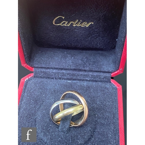 627 - A Cartier 18ct Russian wedding ring comprising three linked yellow, white and rose gold bands, weigh... 