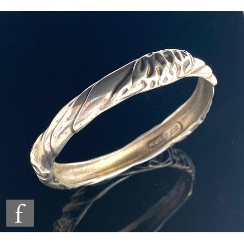 635 - A Danish silver stiff bangle with stylised folded decoration, internal diameter 6.5cm, Ole Kortzau f... 