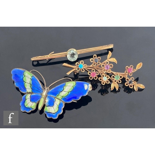 636 - A modern 9ct multi stone spray brooch length 50mm, weight 5.8g, with a similar 9ct topaz bar brooch,... 