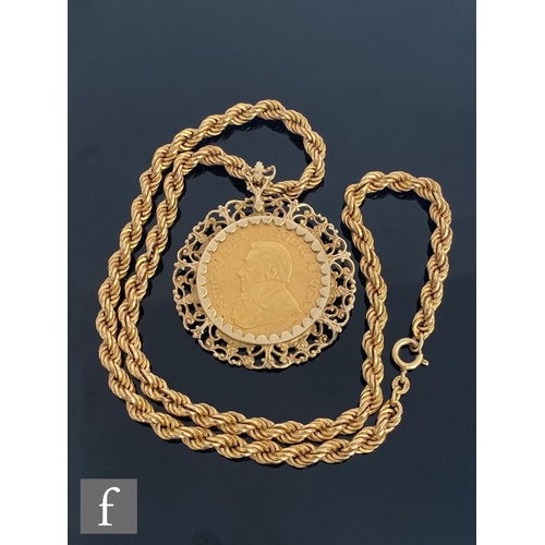 637 - A 1oz Krugerrand dated 1974, loose mounted to a 9ct pierced mount suspended from a 9ct hollow rope t... 