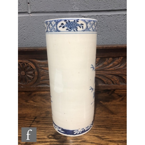 216 - A Chinese late Qing Dynasty (1644-1912) blue and white sleeve vase of cylindrical form, the body pai... 