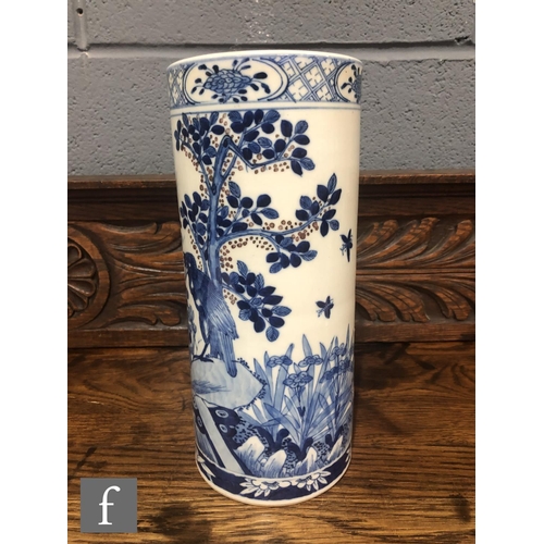 216 - A Chinese late Qing Dynasty (1644-1912) blue and white sleeve vase of cylindrical form, the body pai... 