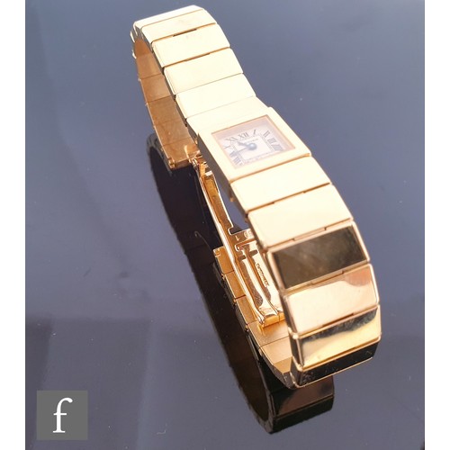 717 - A lady's 18ct gold Cartier quartz bracelet watch with Roman numerals to a square dial, case width 14... 