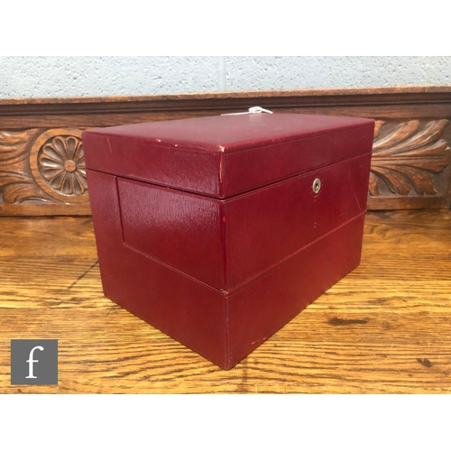 773 - An early 20th Century red leather vanity case, the hinged cover opening to fitted interior with seve... 