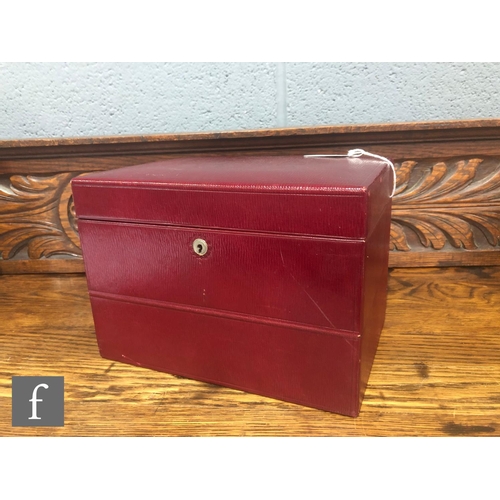 773 - An early 20th Century red leather vanity case, the hinged cover opening to fitted interior with seve... 