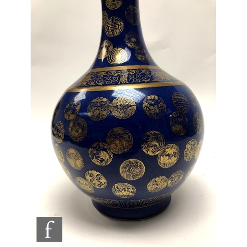 194 - A Chinese Guangxu (1875-1908) powder-blue bottle vase, rising from a high footring, the flecked rich... 