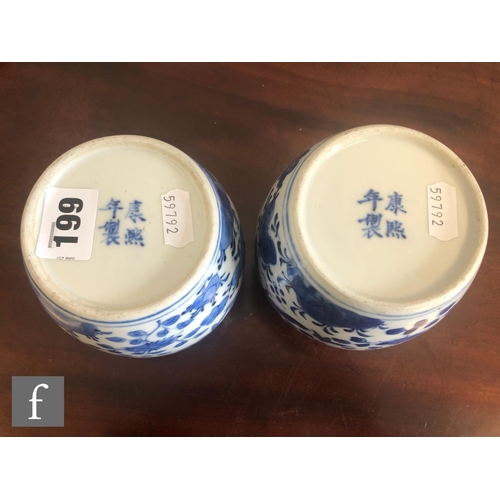 199 - A pair of Chinese blue and white vases, late Qing Dynasty (1644-1912), each of rounded ovoid form de... 