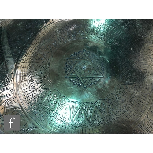 207 - A collection Middle Eastern/Persian brass trays,  to include two plain rimmed examples, with foliate... 