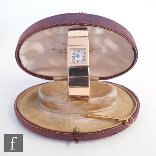 717 - A lady's 18ct gold Cartier quartz bracelet watch with Roman numerals to a square dial, case width 14... 