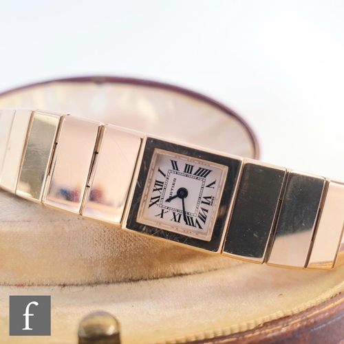 717 - A lady's 18ct gold Cartier quartz bracelet watch with Roman numerals to a square dial, case width 14... 