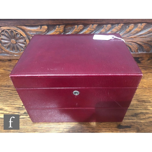 773 - An early 20th Century red leather vanity case, the hinged cover opening to fitted interior with seve... 