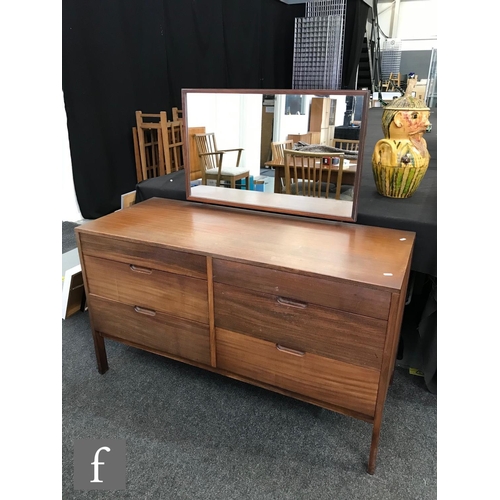 949 - A 1960s teak dressing chest, with rectangular mirror bracket above an arrangement of six drawers wit... 