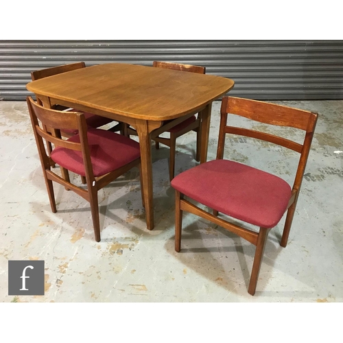 945 - A 1970s Nathan teak extending dining table of rounded rectangular form, on tapered legs, height 75cm... 