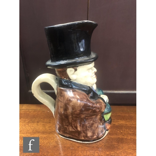 75 - A C.H Brannam character jug modelled as Winston Churchill sat holding a walking cane and smoking a c... 