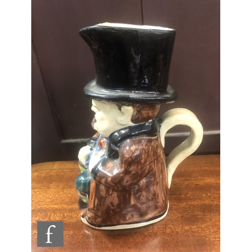 75 - A C.H Brannam character jug modelled as Winston Churchill sat holding a walking cane and smoking a c... 