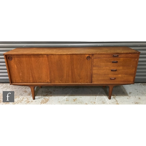 946 - A 1960s Wrighton teak sideboard, fitted with a sliding double door cupboard and a pull-out serving s... 