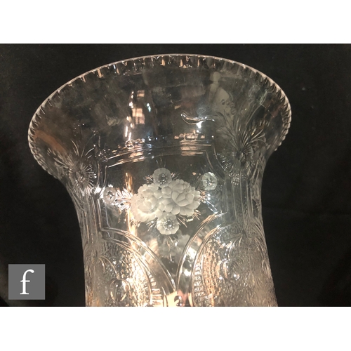 238 - An early 20th Century Webb Corbett clear crystal vase of footed cylindrical form with a flared rim, ... 