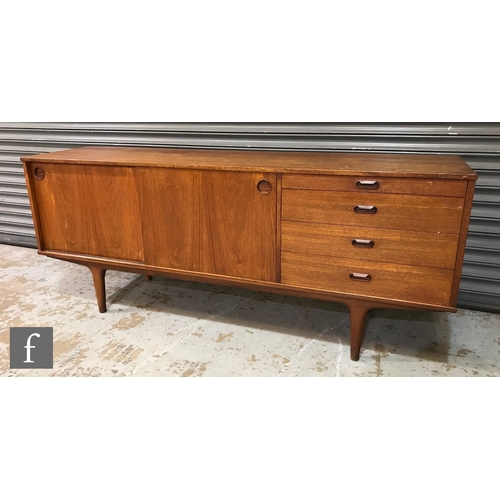 946 - A 1960s Wrighton teak sideboard, fitted with a sliding double door cupboard and a pull-out serving s... 