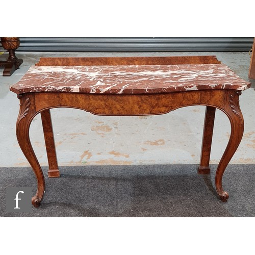 956 - A 19th Century Holland & Sons figured walnut hall table with a serpentine marble top raised to a... 