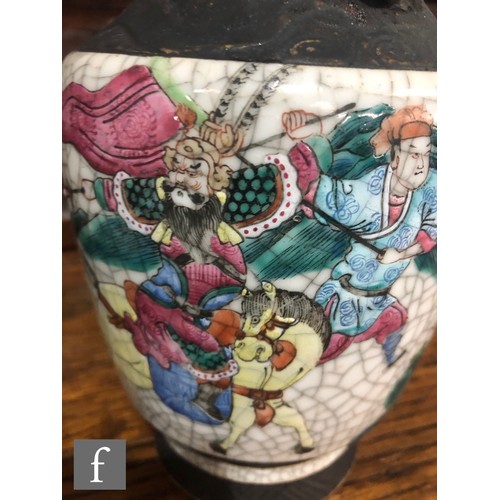 195 - A pair of 20th century Chinese crackle ware vases painted with warriors and figures in landscape sce... 