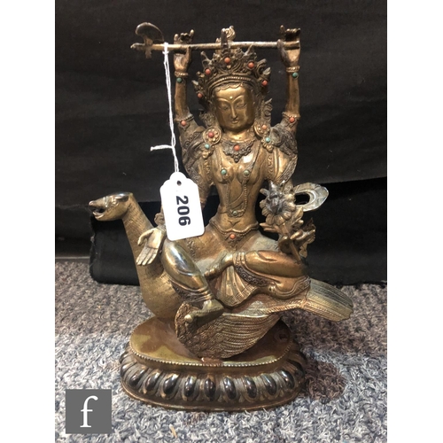 206 - A Sino-Tibetan figure of Avalokitesvara, cast seated on bird, holding a ritual axe aloft, and furthe... 