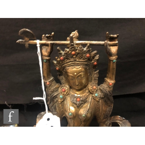 206 - A Sino-Tibetan figure of Avalokitesvara, cast seated on bird, holding a ritual axe aloft, and furthe... 