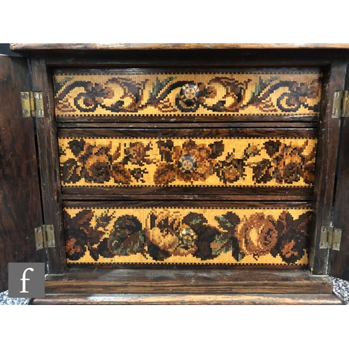 764 - A 19th Century Tunbridgeware mosaic inlaid table cabinet fitted with three drawers enclosed by a pai... 