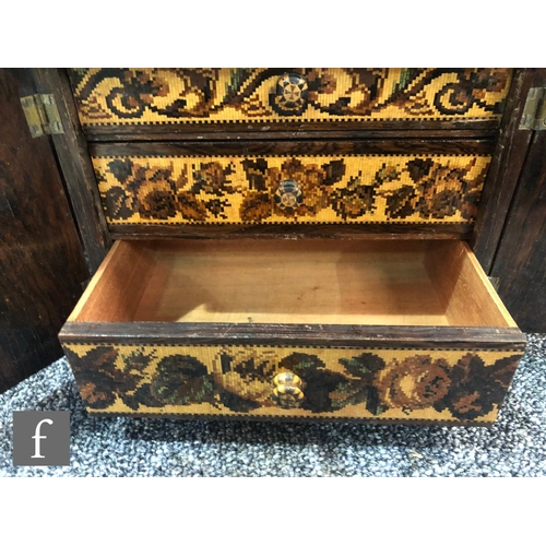 764 - A 19th Century Tunbridgeware mosaic inlaid table cabinet fitted with three drawers enclosed by a pai... 