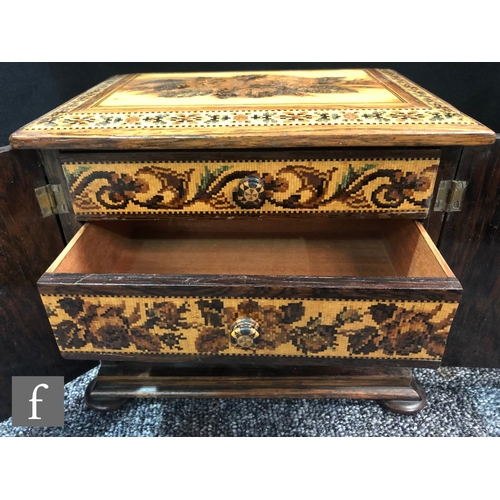 764 - A 19th Century Tunbridgeware mosaic inlaid table cabinet fitted with three drawers enclosed by a pai... 