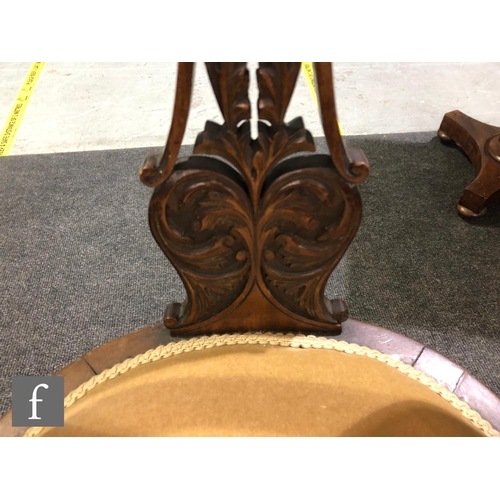 179 - A pair of Edwardian walnut salon chairs having a central pierced and foliate carved splat with acant... 