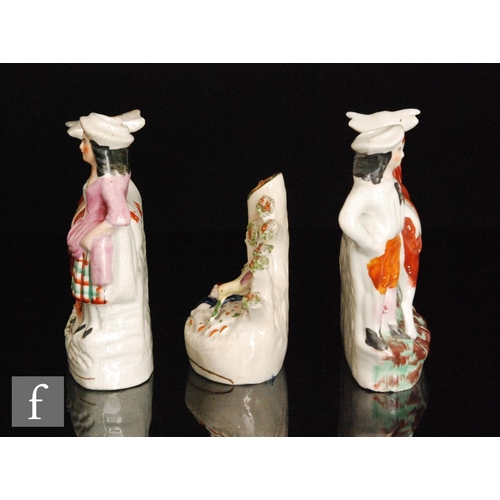 108 - Two mirrored Staffordshire spill vases modelled as facing cows with a lady and gentleman stood behin... 