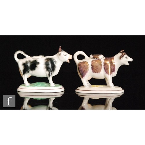 110 - Two 19th Century Staffordshire cow creamers and covers, the first with dark Sunderland lustre type d... 