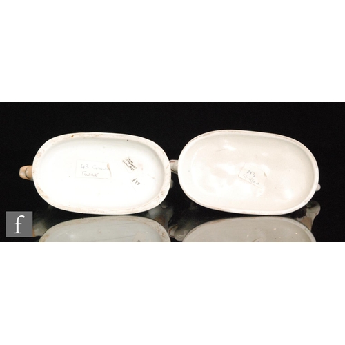 110 - Two 19th Century Staffordshire cow creamers and covers, the first with dark Sunderland lustre type d... 