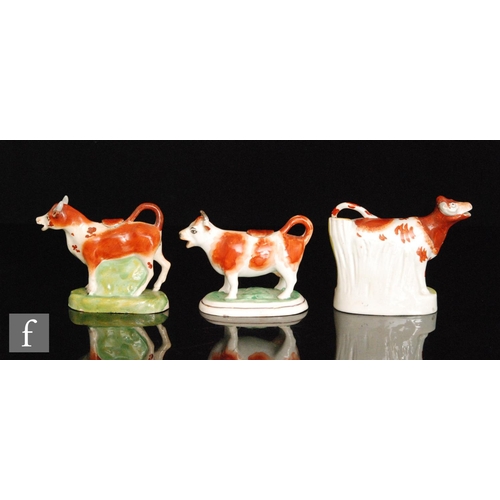 114 - Two late 19th Century cow creamers and covers, both with brown sponged decoration, largest height 15... 