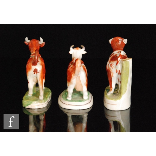 114 - Two late 19th Century cow creamers and covers, both with brown sponged decoration, largest height 15... 