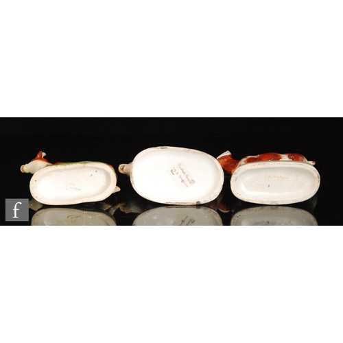 114 - Two late 19th Century cow creamers and covers, both with brown sponged decoration, largest height 15... 